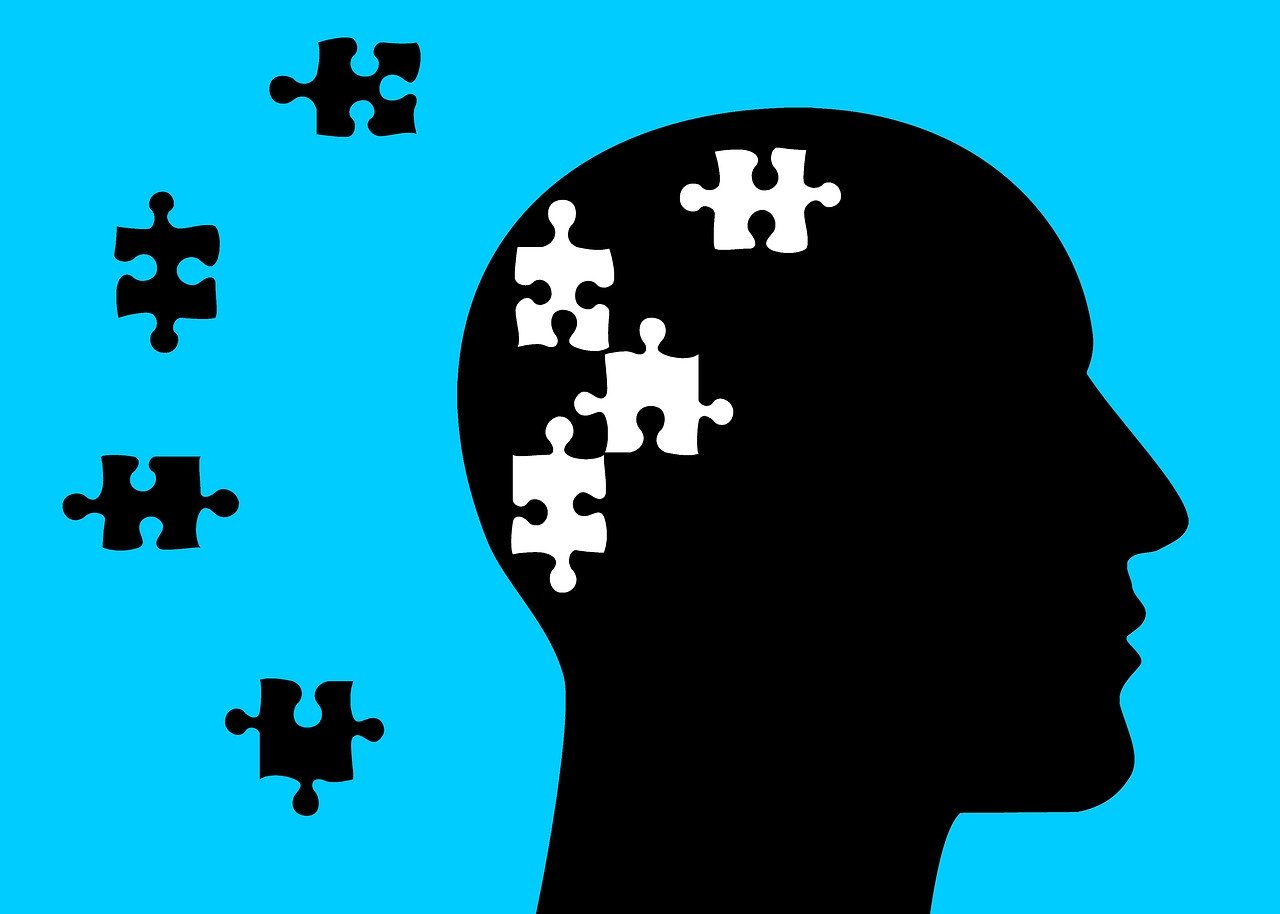Kopf mit fehlenden Puzzelteilen